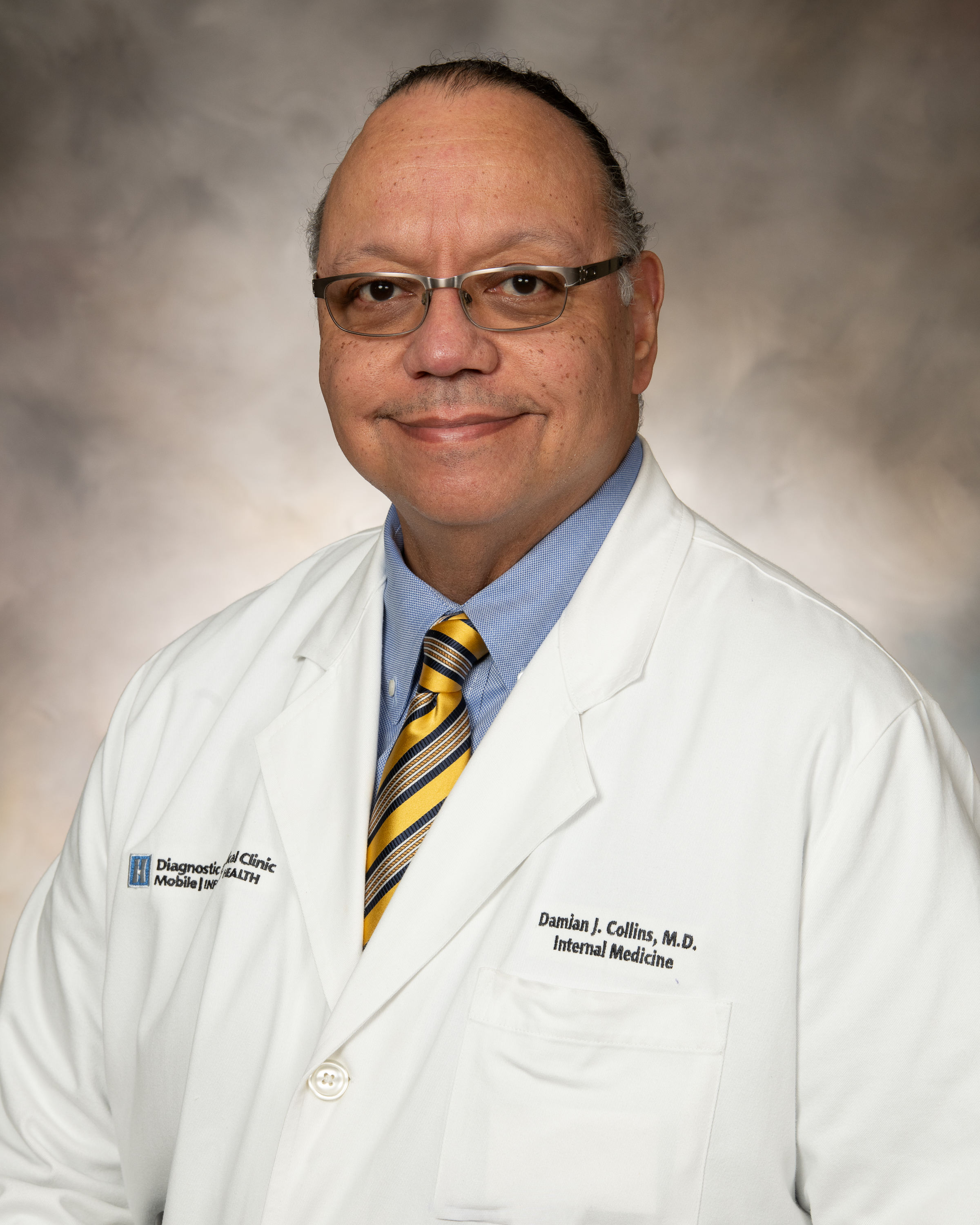 Damian J Collins MD